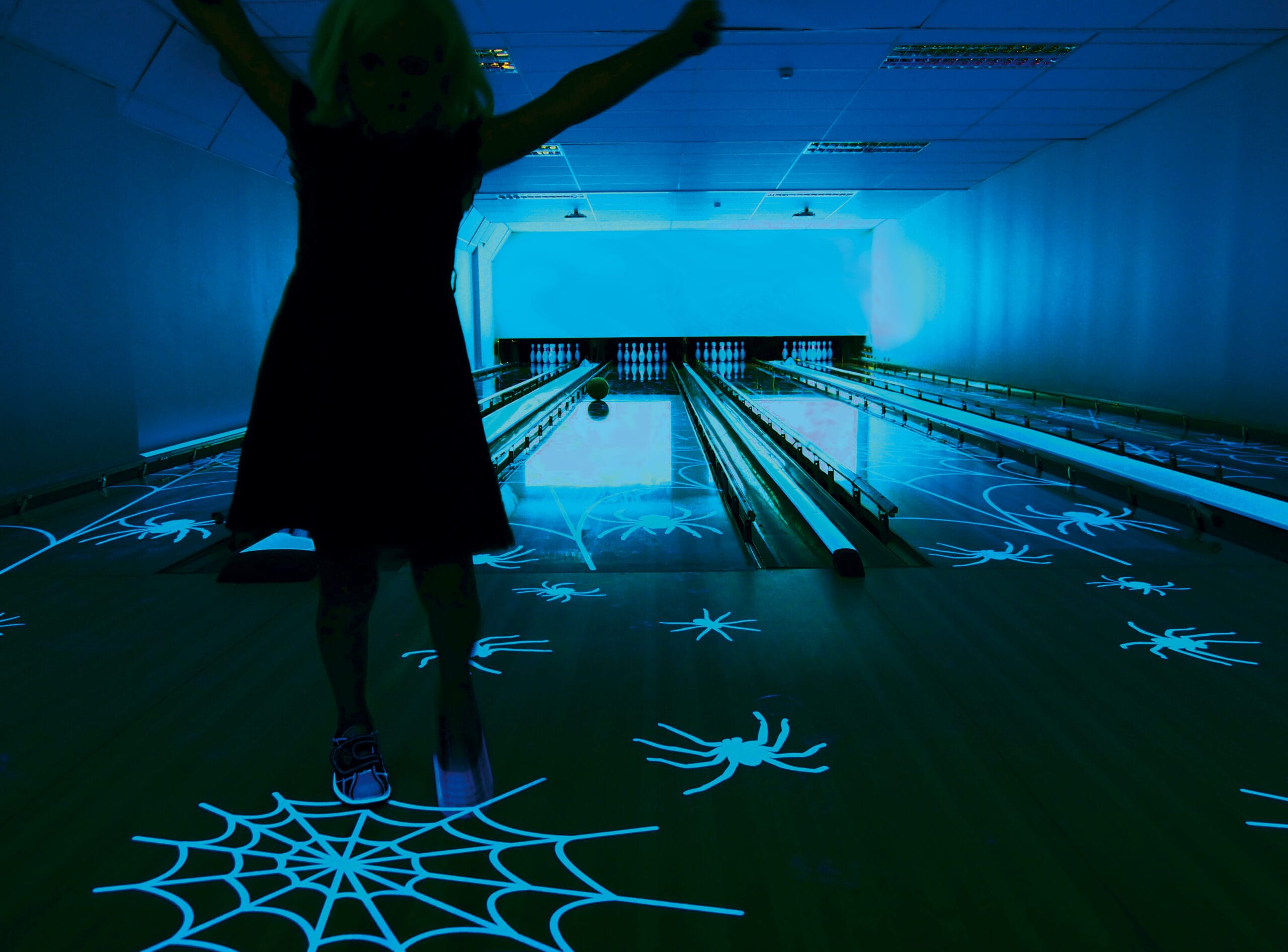 Happy girl at the bowling alley